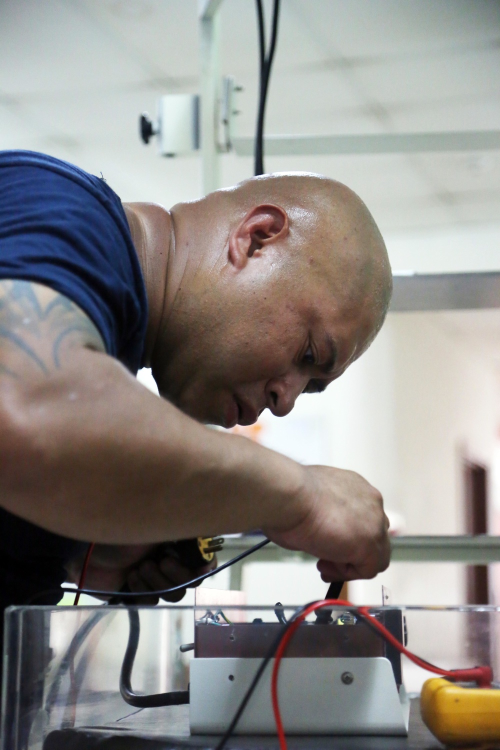 Hospital Corpsman Repairs Guatemalan Medical Equipment during SPS 17
