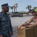 Sailors Hand Out Supplies at Searstown FEMA Distribution Point