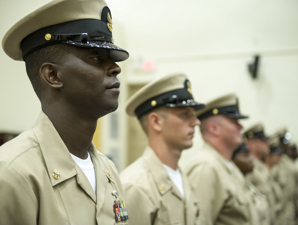 Sailors assigned to Commander, Naval Surface Force Atlantic donned new combination covers and fresh khaki uniforms when they were advanced to the rank of chief petty officer (CPO) during a pinning ceremony Sept. 15.
