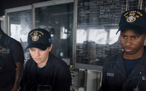USS Lake Erie (CG 70) Sailors man the helm