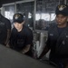 USS Lake Erie (CG 70) Sailors man the helm