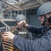 USS America Sailors participate in live fire exercise