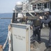 USS America Sailors participate in live fire exercise