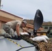 Tech. Sgt. Michael Miller, 269th Combat Communications Squadron, Ohio Air National Guard, adjusts the configuration of a satellite dish in St. Thomas, U.S. Virgin Islands Sept. 15, 2017. Brown is part of a six-person team providing tactical communications