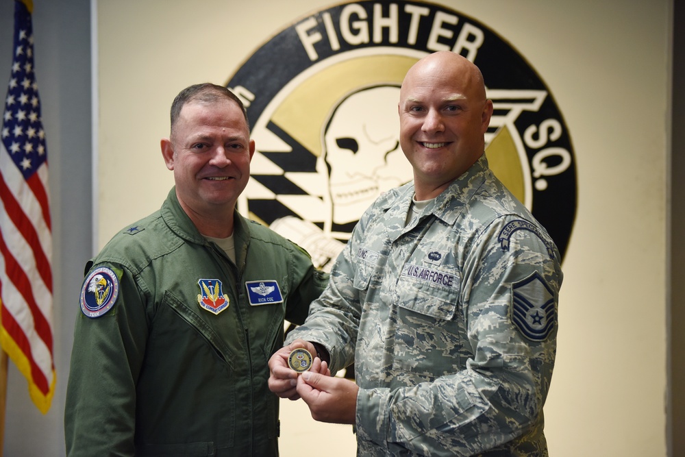 Master Sgt. Young coined by ACC/IG