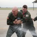 Maj. Gen. Zadalis  attempts to evade being sprayed with water following his “fini” flight