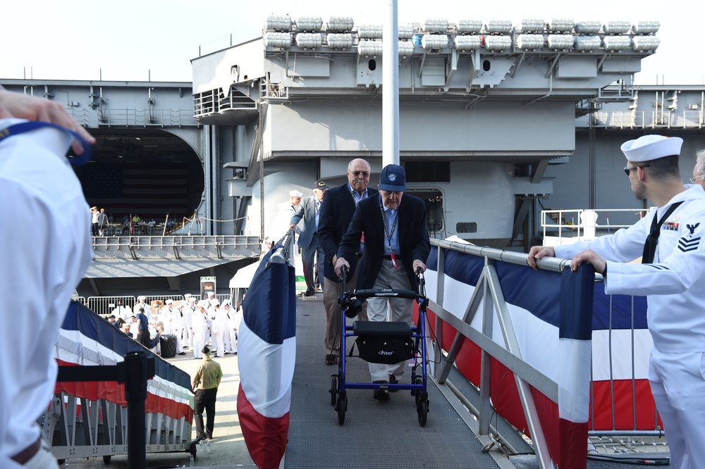 Veterans board USS Gerald R. Ford (CVN 78) prior to the ship's commissioning ceremony