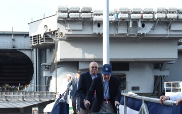 Veterans board USS Gerald R. Ford (CVN 78) prior to the ship's commissioning ceremony