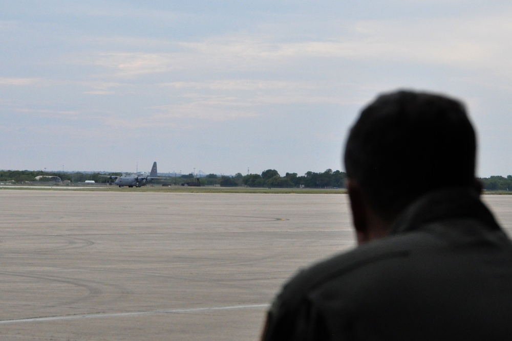 After launch at Kelly Field: activity continues at the 910th’s aerial spray ops base