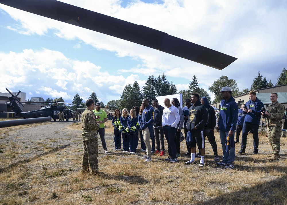 Navy Region Northwest Passes Seahawks’ 12th-Man Flag to 1st Special Forces Group