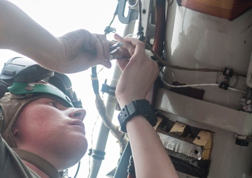 USS America Marine conducts maintenance