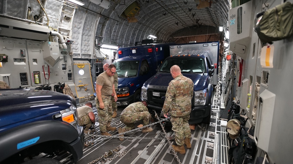 Utah's 85th CST load equipment on a C-17 to return from Kauai