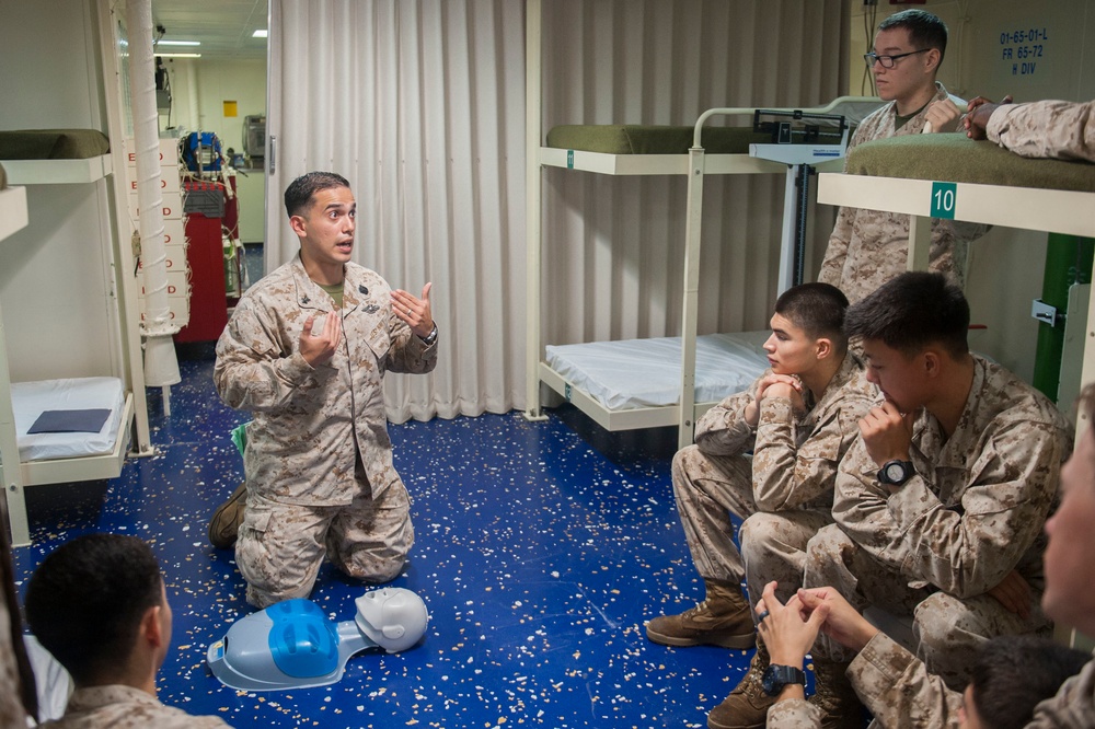 USS America Sailor instructs CPR class