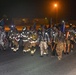 Firefighters and security forces participate in a 9/11 memorial walk