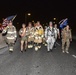Firefighters and security forces participate in a 9/11 memorial walk