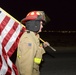 Firefighters and security forces participate in a 9/11 memorial walk
