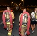 Firefighters and security forces participate in a 9/11 memorial walk