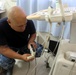 Hospital Corpsman Repairs Guatemalan Medical Equipment during SPS 17