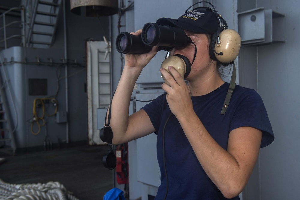 Sailor Speaks Through Sound Powered Phone on Nimitz