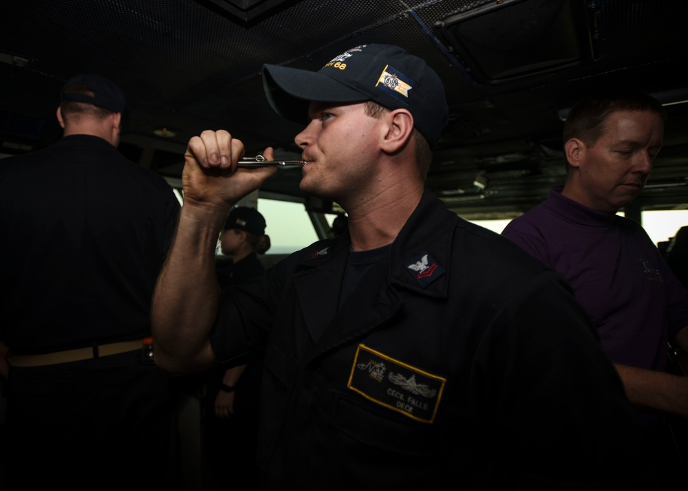 Sailor Blows Boatswain's Pipe