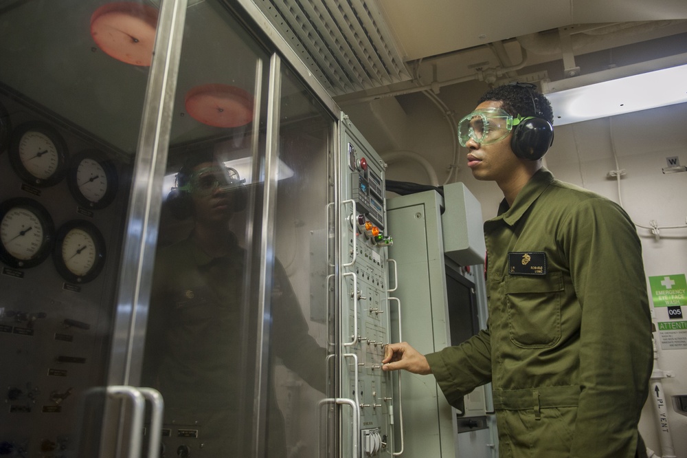 USS America Marine tests hydraulic line