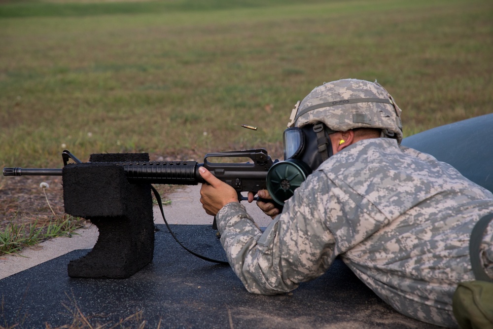 Army Reserve Soldier qualifies on rifle range with protective gas mask