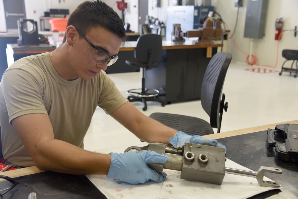 22nd MXS Airmen repair spoiler actuator