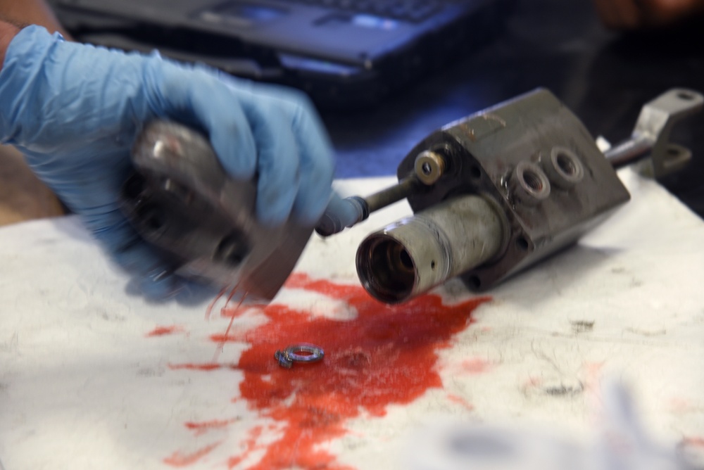 22nd MXS Airmen repair spoiler actuator