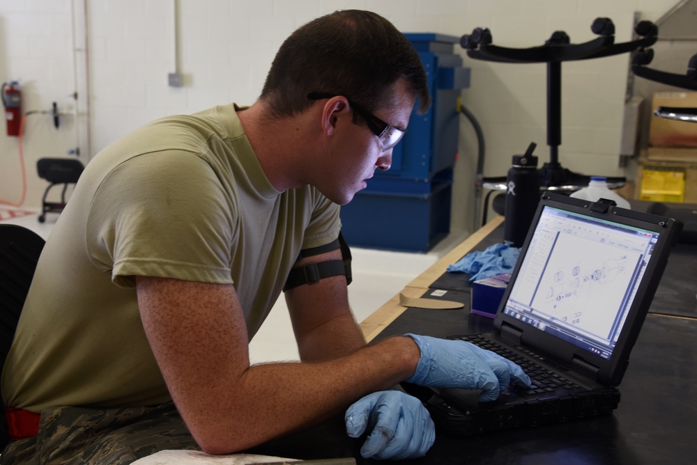 22nd MXS Airmen repair spoiler actuator