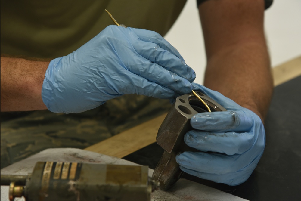 22nd MXS Airmen repair spoiler actuator