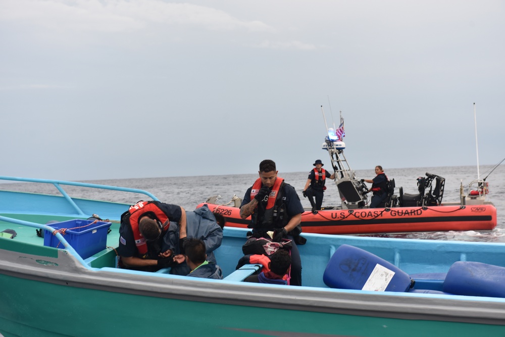 Cutter Stratton boarding team members detain four suspected smugglers