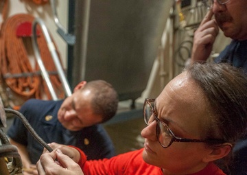 USS America Sailors repair sprinkler system