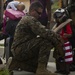 U.S. Marines help young evacuee on Dominica