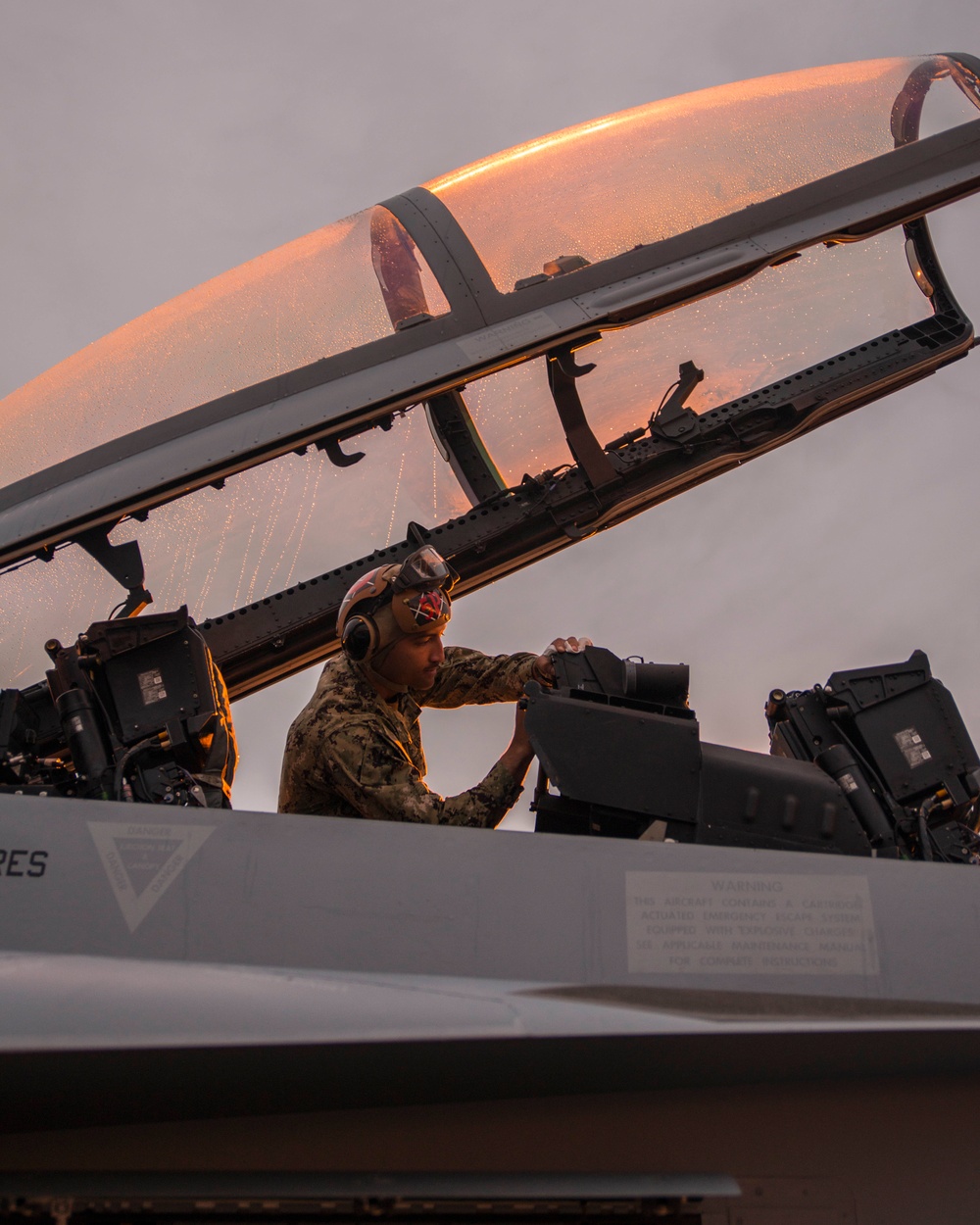 Airman conducts inspection on EA-18G