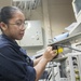 USS America Sailor prepares signal generator