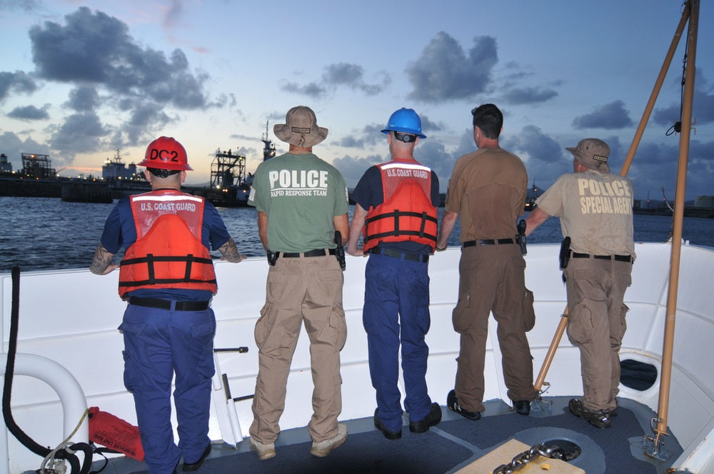 Coast Guard and DHS special agents scan piers in St. Croix following Hurricane Maria