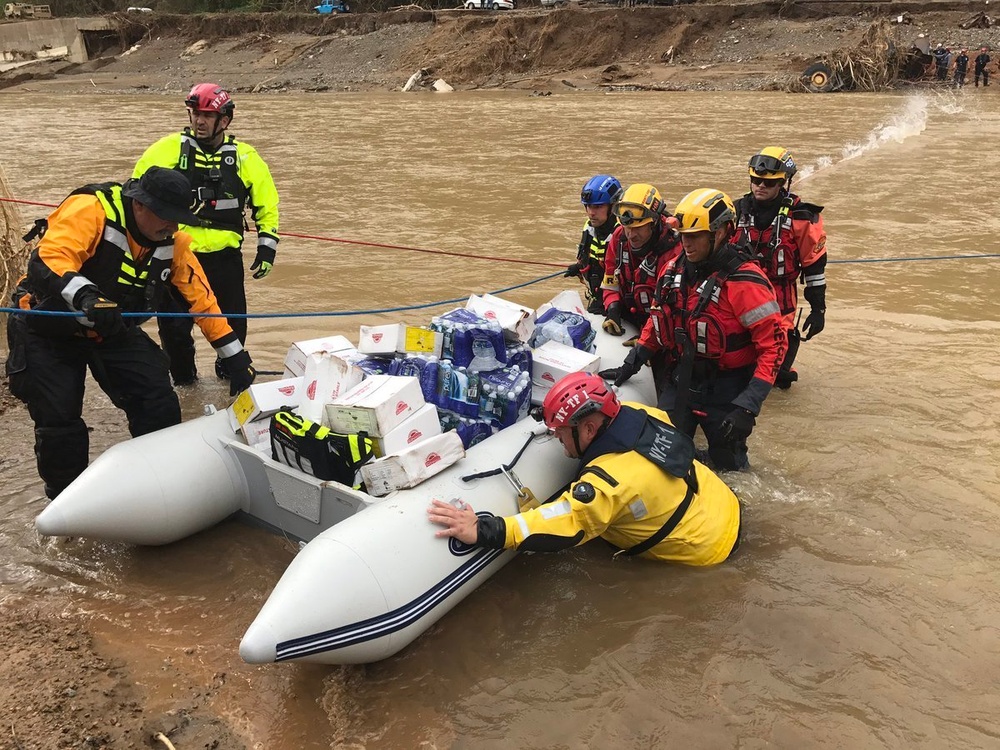 FEMA USAR Brings Supplies Across a River