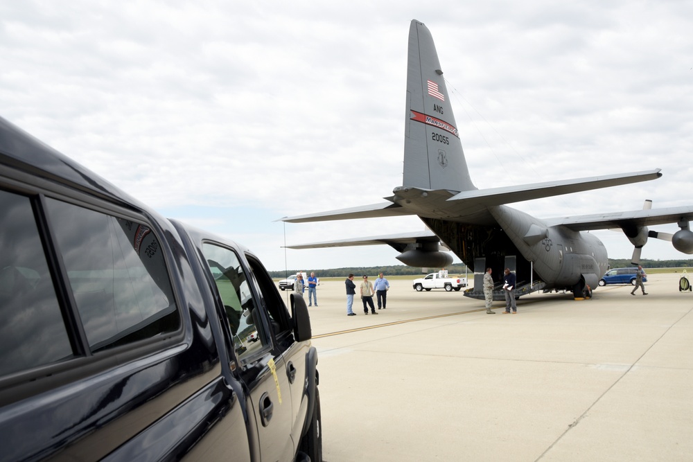 A truck from the 269th Combat Communications Squadron, Springfield Air National Guard Base, Ohio is prepared to be loaded onto a C-130 Hercules from the 179th Airlift Group, Mansfield Ohio at Wright-Patterson Air Force Base as a seven-member team from the