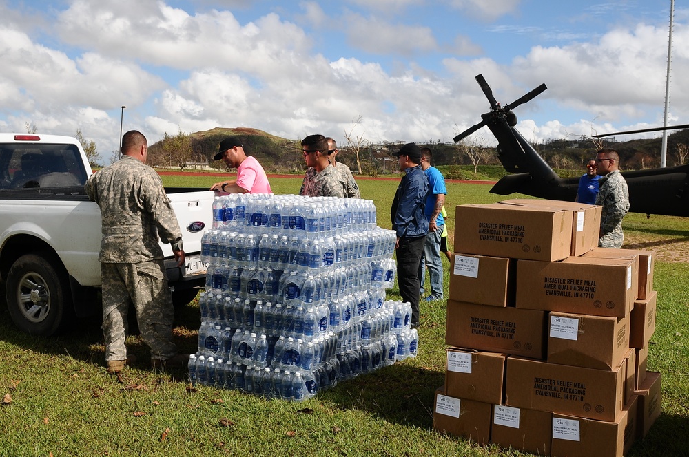Puerto Rico National Guard Distribute Water And Food