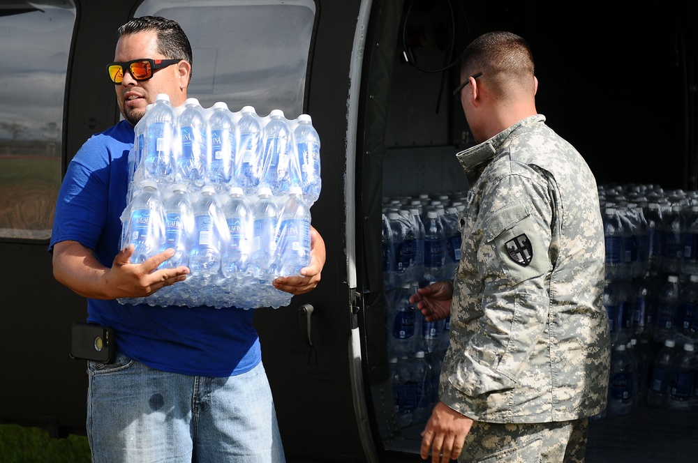 Puerto Rico National Guard Distribute Water And Food