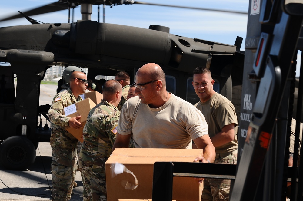 Puerto Rico National Guard Distribute Water And Food