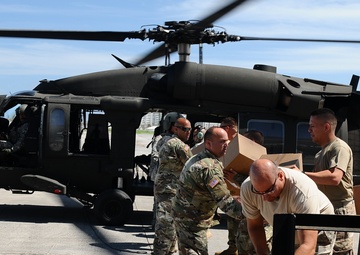 Puerto Rico National Guard Distribute Water And Food