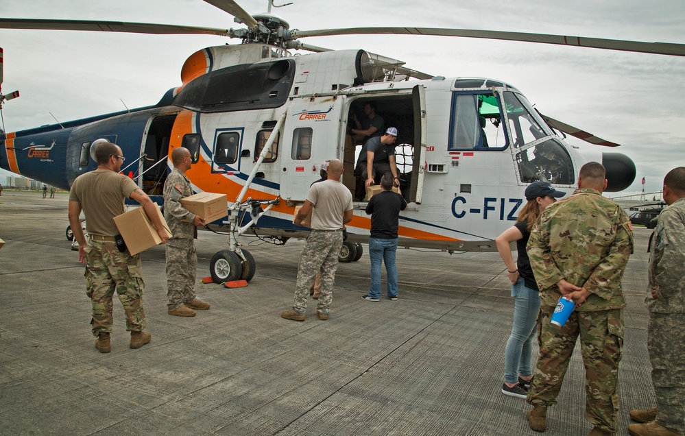 Loading helicopter with FEMA meals