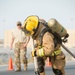 Firefighters with the U.S. Air Force and Qatar Emiri Air Force complete a firefighter combat challenge at Al Udeid Air Base