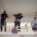 Firefighters with the U.S. Air Force and Qatar Emiri Air Force complete a firefighter combat challenge at Al Udeid Air Base