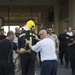 Firefighters with the U.S. Air Force and Qatar Emiri Air Force complete a firefighter combat challenge at Al Udeid Air Base