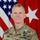 U.S. Army Brig. Gen. Douglas A. Sims This is an official U.S. Army portrait of a Brigadier General named Sims, wearing the Operational Camouflage Pattern (OCP) uniform. He is posed in front of the American flag and a red general officer flag displaying one white star, consistent with the rank of Brigadier General. His uniform displays multiple badges and insignia including a Ranger tab and U.S. Army patch.