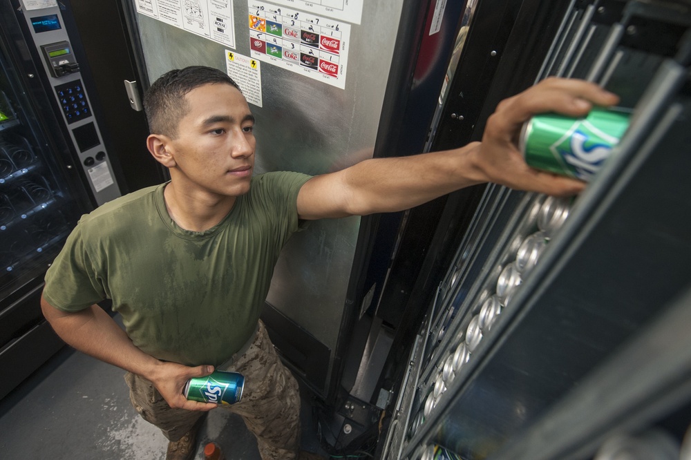 USS America Marine restocks vending machines