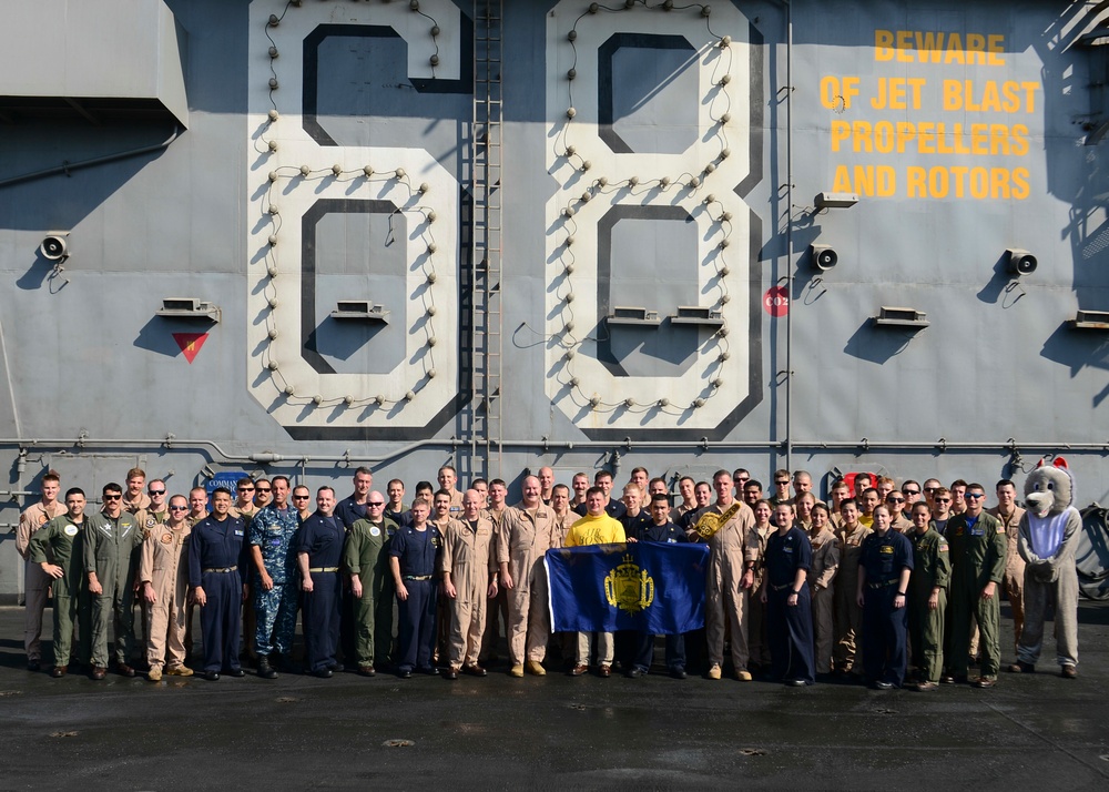 Naval Academy Graduates Pose For Photo Aboard Nimitz