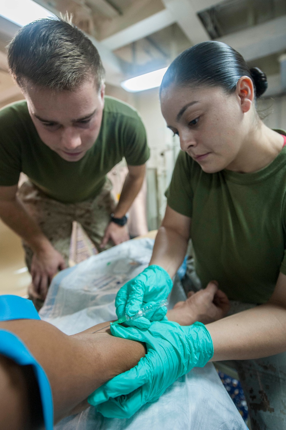 USS America Sailors and Marines participate in IV drill